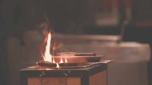 Strong charcoal fire grilling ingredients on the grill