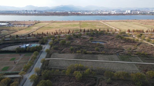 Expansive parkland with river and city view