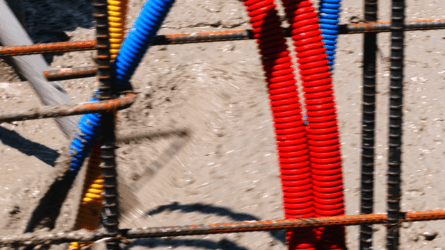 Concrete being poured with rebar structure