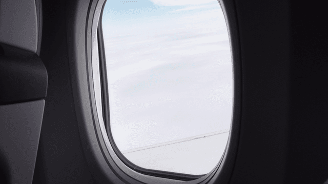 View of clouds through an airplane window