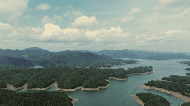 Vast lake surrounded by lush mountains