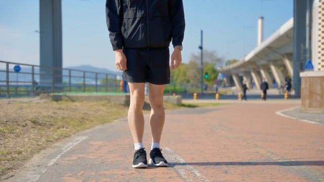 Man preparing to run on a sunny day