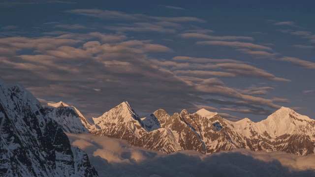 Snow-capped mountains at sunset