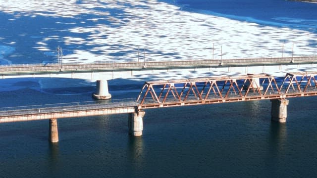 Aerial View of Bridges over Frozen River