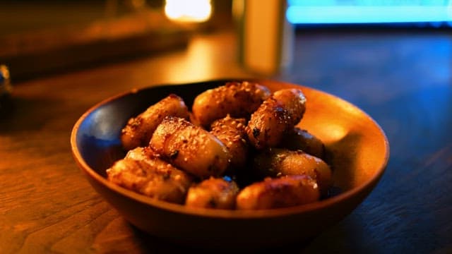 Delicious oily tteokbokki neatly arranged in a wooden bowl