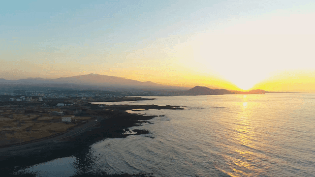 Serene coastal landscape at sunrise