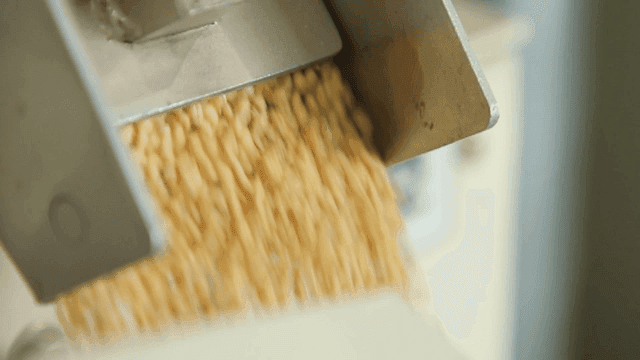 Grains flowing from a processing machine