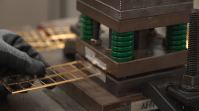 Metal stamping process in a factory