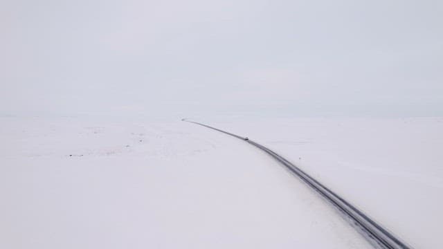 Car driving on a snowy road