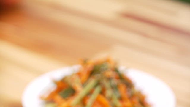 Spicy and sour apple parsley salad on wooden table