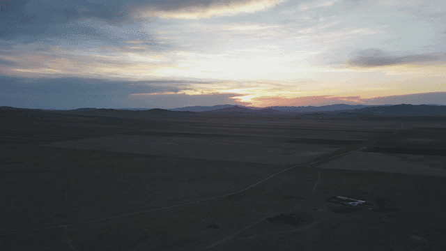 Twilight fading over vast meadow
