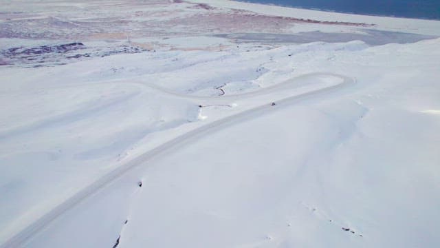 Winding road through a snowy landscape