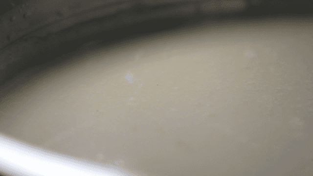 Pot of creamy white broth