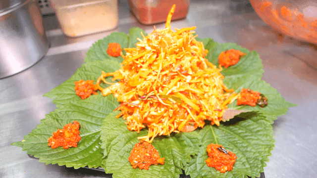 Raw fish salad mixed with perilla leaves and spicy seasoning