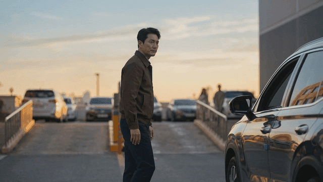 Man stopping car in front of car