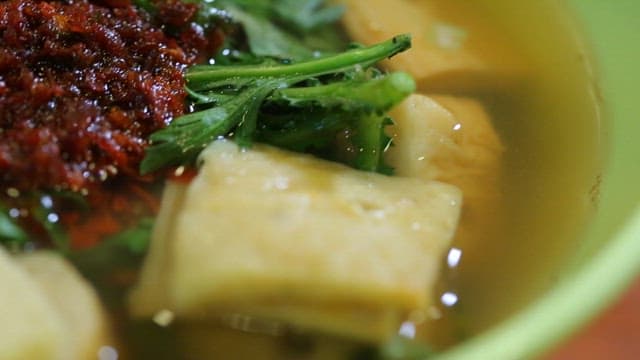 Warm soup with spicy sauce and fish cake