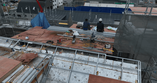 Construction workers on a rooftop
