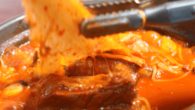 Aged kimchi pork rib stew boiling in pot