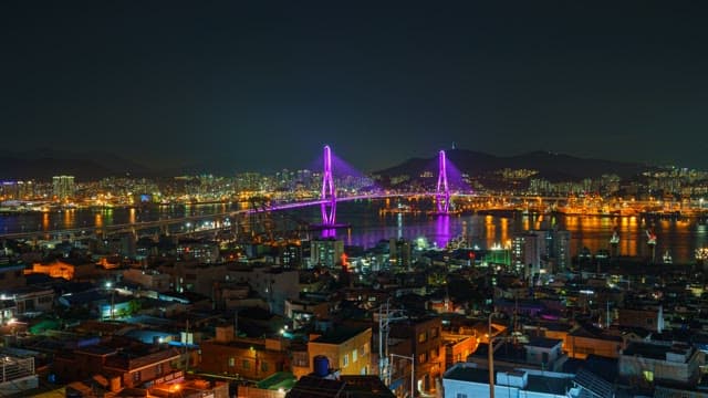 Vibrant Night View of Illuminated City Bridge