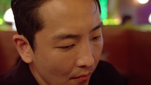 Man sitting in a dark bar