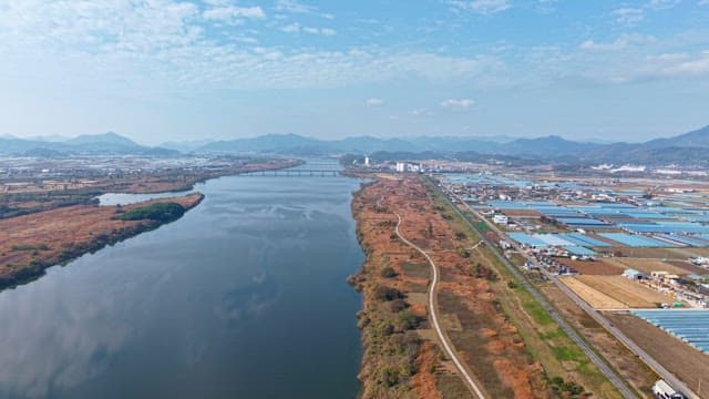 Wide river flowing through a rural landscape