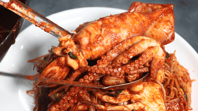 Spicy seafood stew with squid and crab