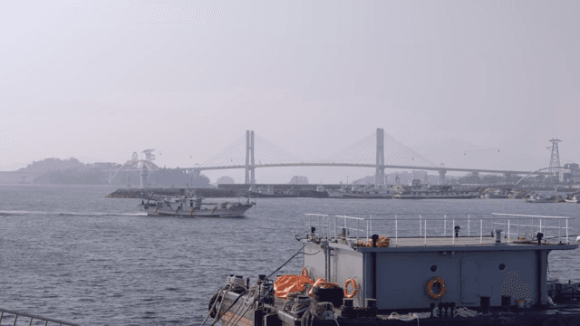 Bridge and ships on a calm sea