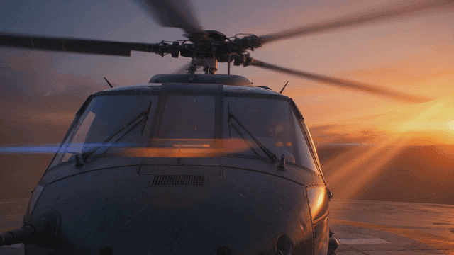 Helicopter on a helipad at sunset