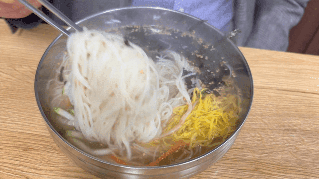 Warm banquet noodles in a steel bowl