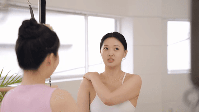 Student greeting the Pilates instructor