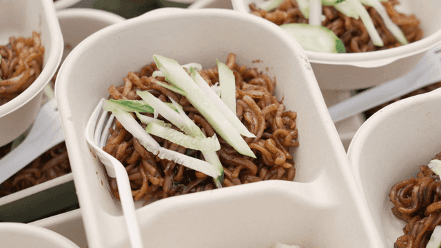 Jjajangmyeon topped with cucumber slices