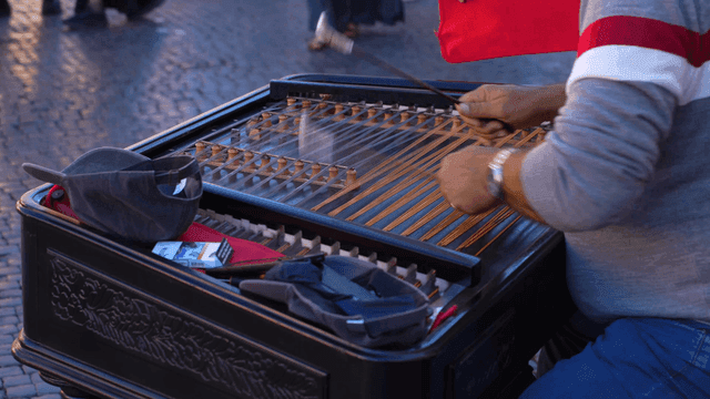 Street musician playing a hammered dulcimer