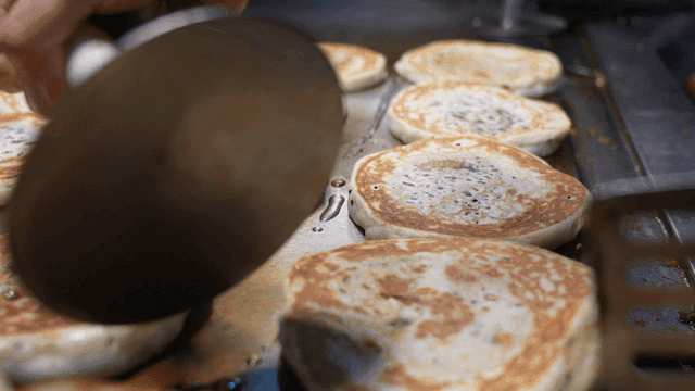 Hotteok fried on iron plate