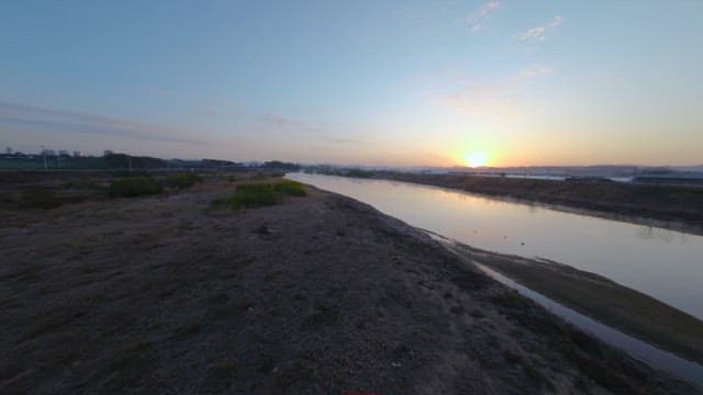 Sunrise over the Calm Water of the River