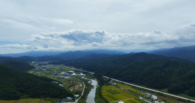 View of a rural with mountains and fields