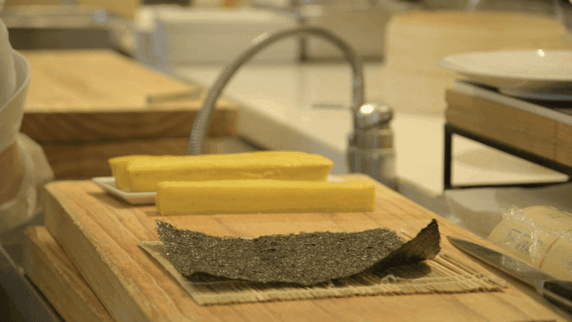 Chef preparing kimbap and rolled eggs
