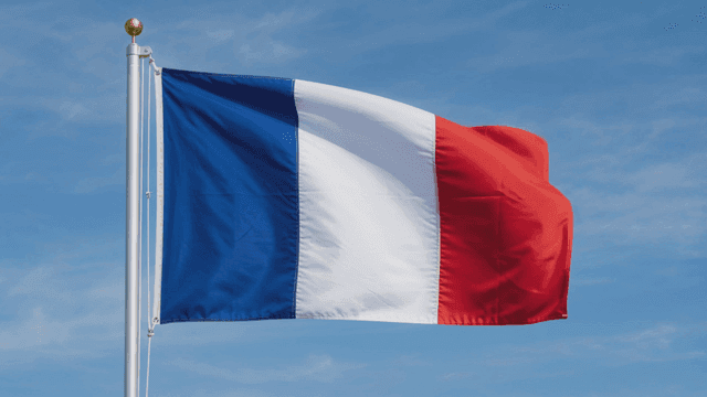 French flag waving against a clear sky