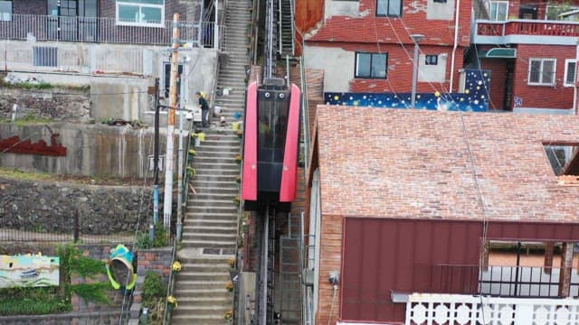 Monorail passing through the densely populated Choryang Story the Way