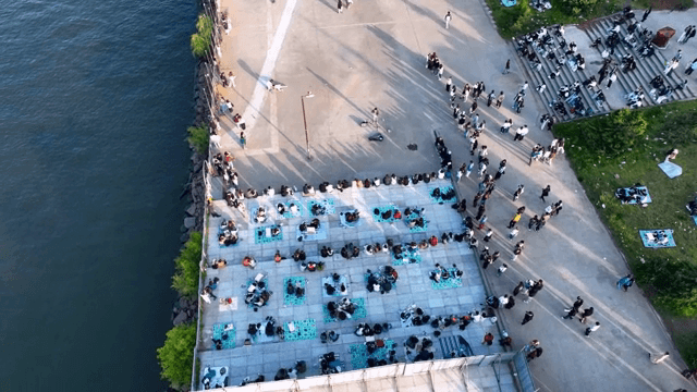 People gathering by the riverside park