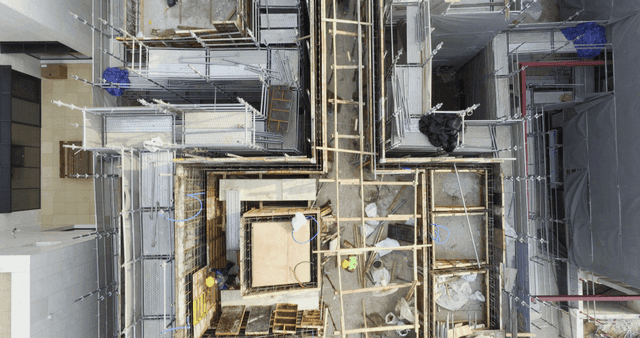 Construction site with workers and materials