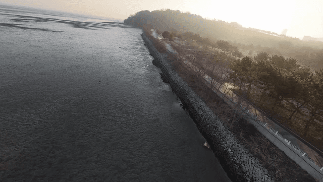 Sunset over a serene coastal landscape