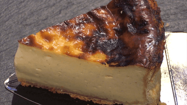 Slice of cream cheese cake on plate