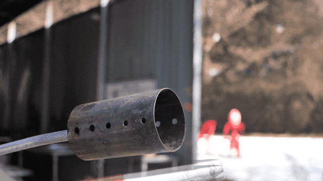 Torch with flame at industrial site