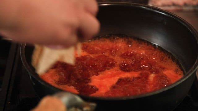 Cooking spicy tteokbokki with fish cake and green onion