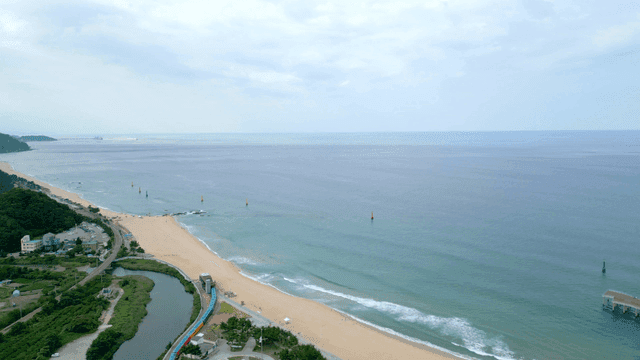 Tranquil beach with waves and coastline