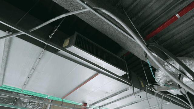 Ceiling with exposed ducts and wiring