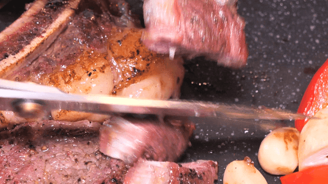 Scissors for grilled steak with vegetables