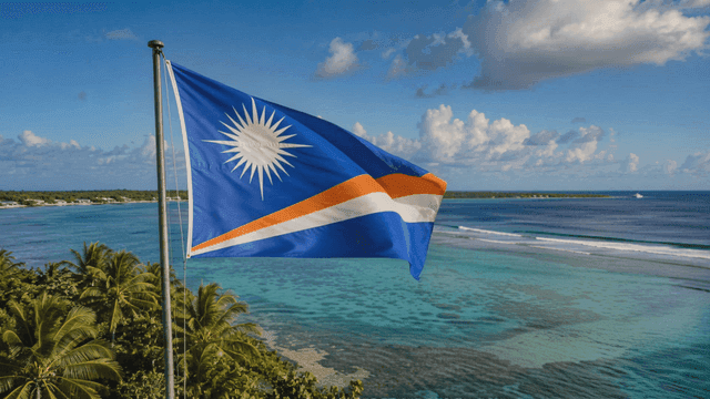Marshall Islands flag fluttering beside palm trees and sea