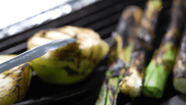 Grilled onions and vegetables on a barbecue