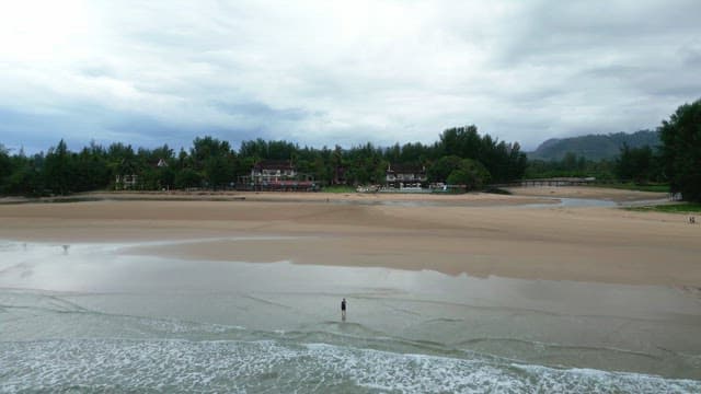 Serene beach with distant resorts